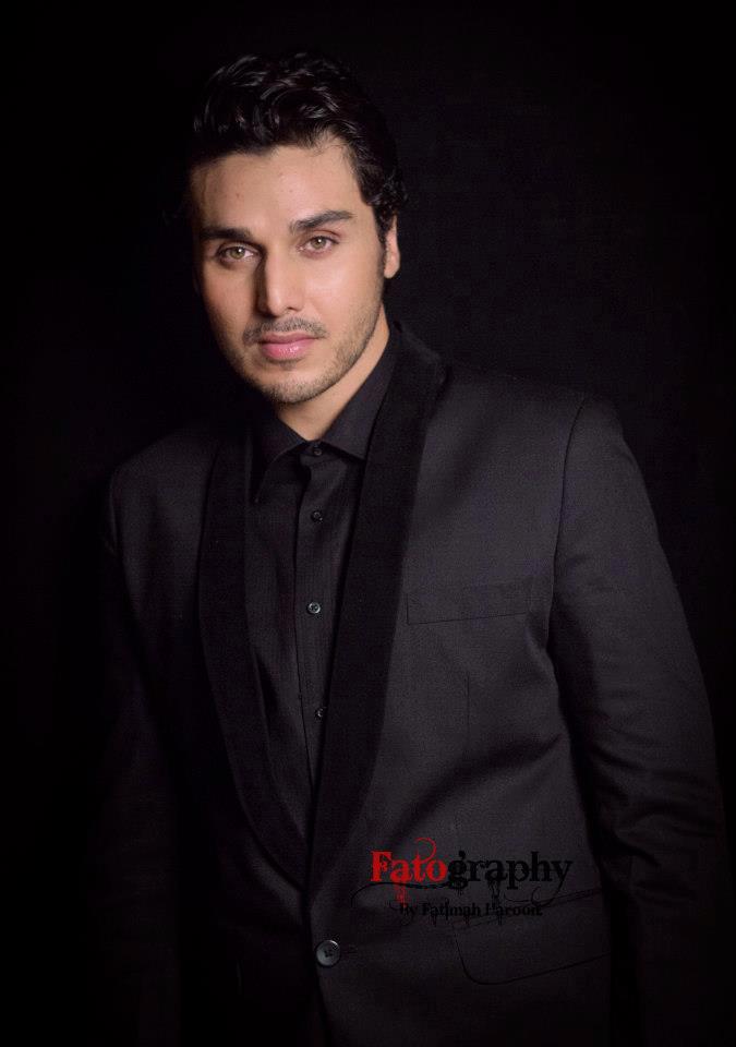 ahsan khan wearing black suit