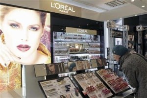 A woman looks at L'Oreal cosmetics in the shop in Riga