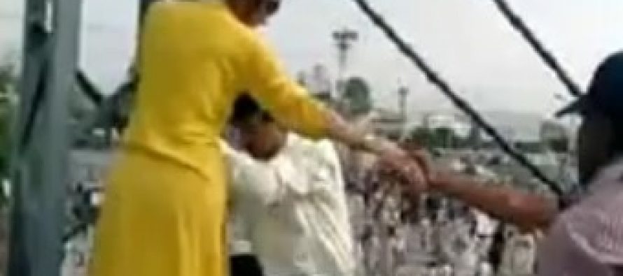 Gharida Farooqi Climbing Poles To Cover An Event