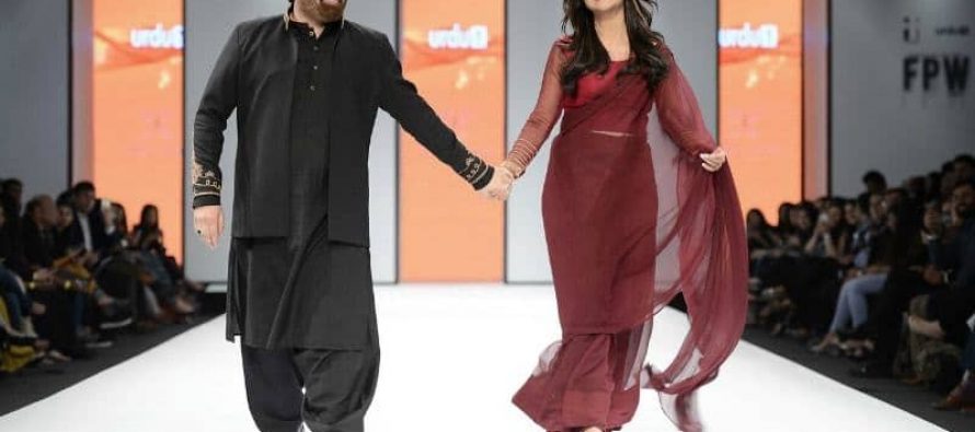 Nida and Yasir walk the ramp together
