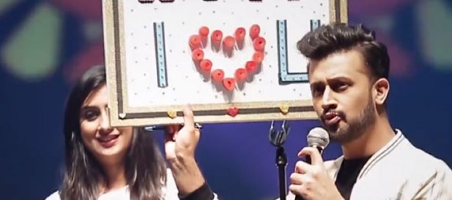 Fan girl comes up on stage and refuses to let go during Atif Aslam’s concert