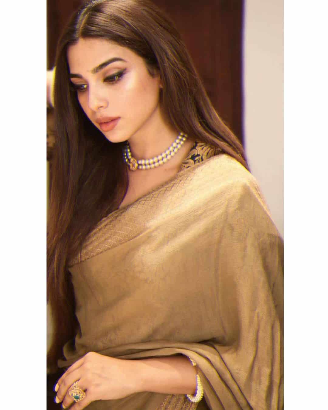 Gorgeous Sonya Hussyn in Royal Gold Saree with Pearl Necklace