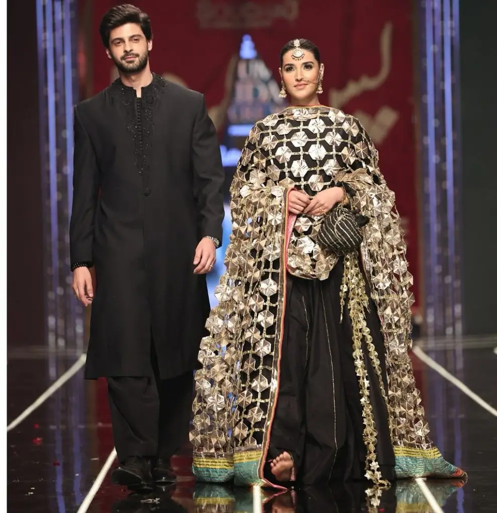 Bismal's Musa and Masooma walk the ramp together.