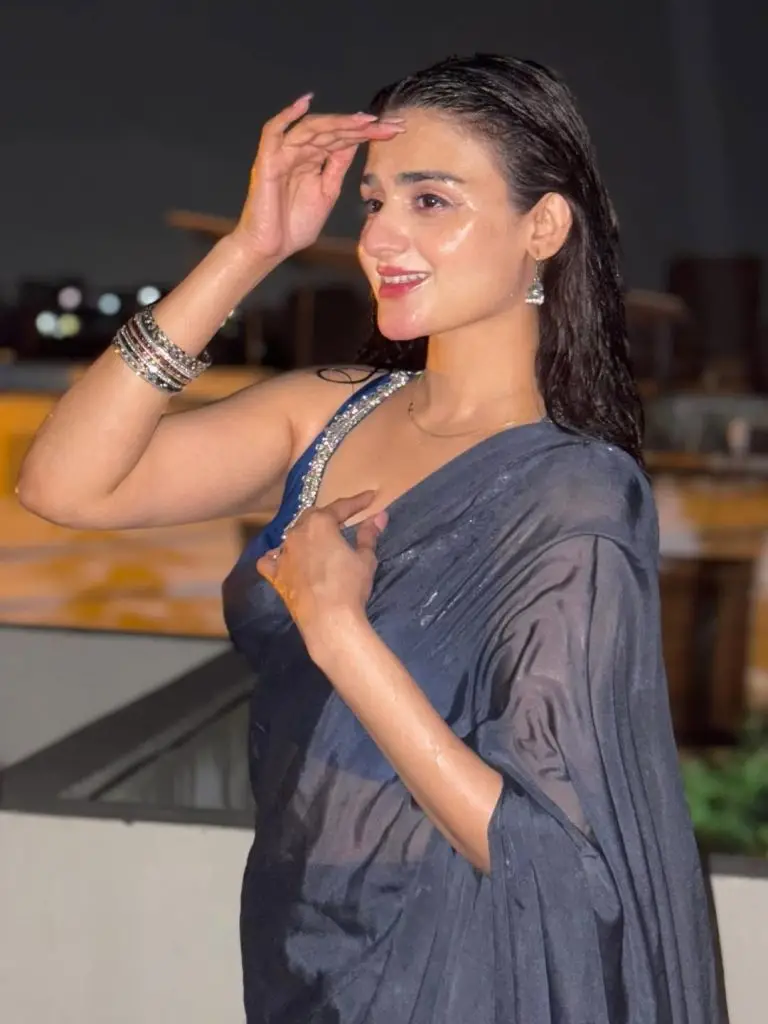Hira Mani Criticized for Bold Saree & Caption Enjoying rain